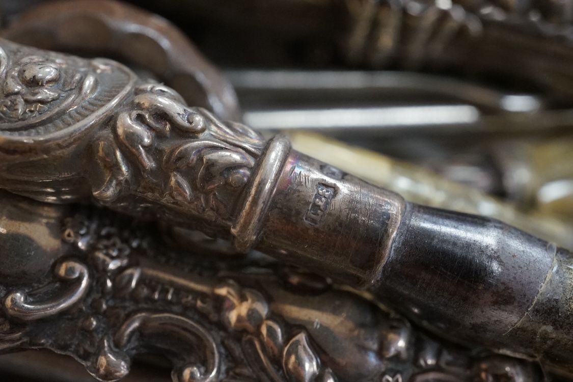 A large collection of Victorian button hooks, with silver, plate, mother of pearl and other handles